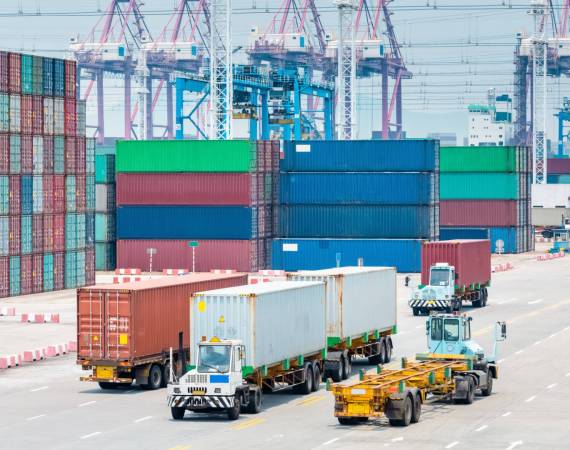 busy container terminal closeup, brisk trade and economic growth concept