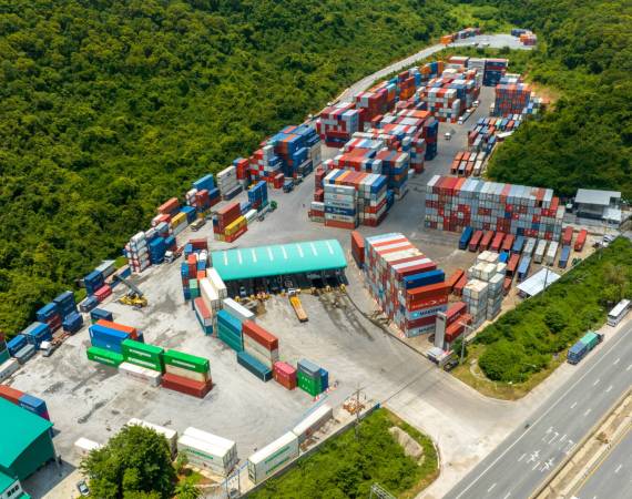Shipyard Cargo Container Sea Port around mountain Freight forwarding service logistics and transportation. International Shipping Depot Custom Port for import export trade Transport Business shipping