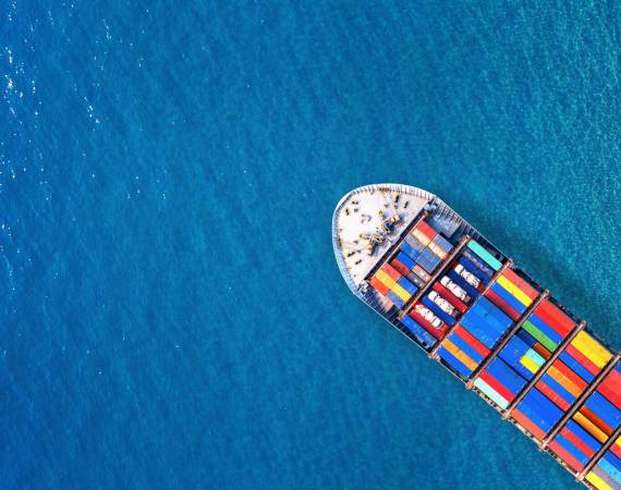 Aerial view of container cargo ship in sea.